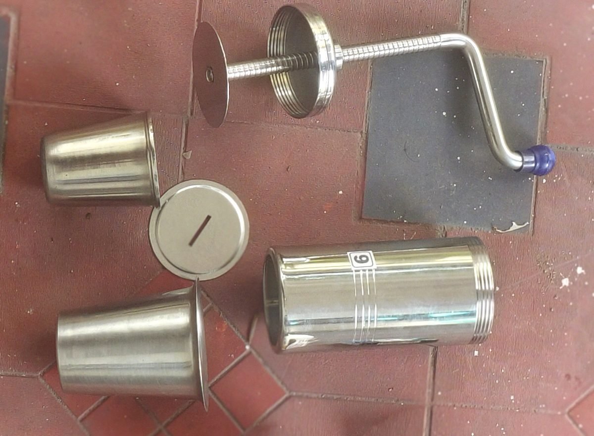 Parts of the miniature prototype press: barrel, screw plunger with crank, end plate and moulds